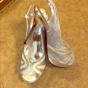 Silver high heels brand new size 8.5